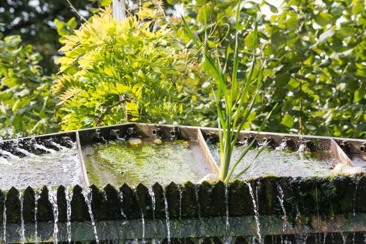 Small weir waterfall in a public park