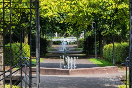 Small weir waterfall fountain in a public park