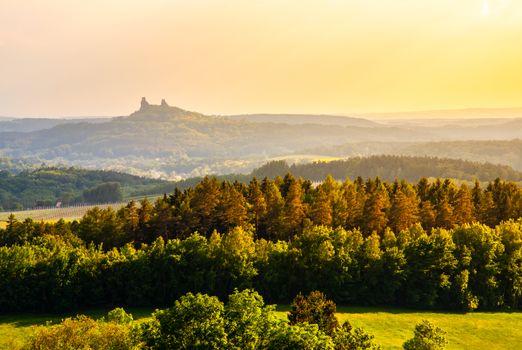Landscape with Ruins of Trosky Castle in Bohemian Paradise at sunset time, Czech Republic.