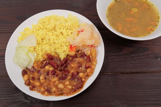 Red beans with curry rice on a wooden table