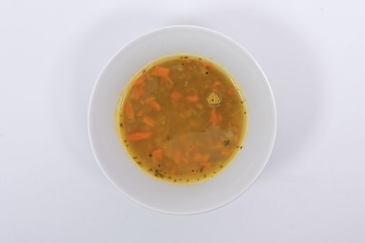 Lentil soup with carrots on a white background