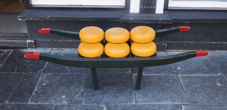 whole dutch chees at the market in Delft in Holland, cheese is typical dutch food