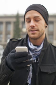 Traveling Man With Mobile Phone And Hat, In City, Urban Space