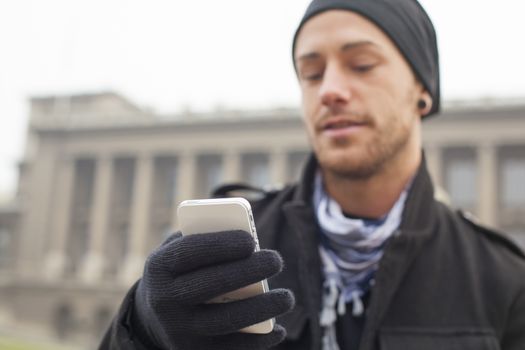 Traveling Man With Mobile Phone And Hat, In City, Urban Space