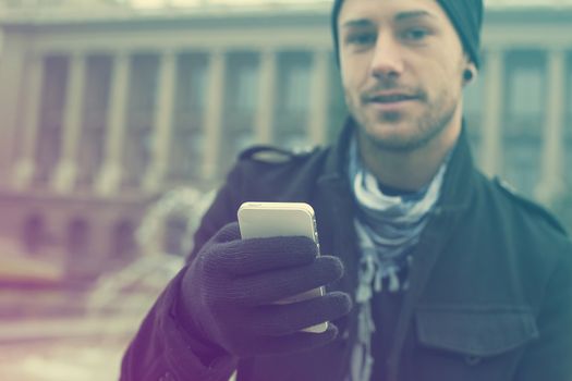 Traveling Man With Mobile Phone And Hat, In City, Urban Space