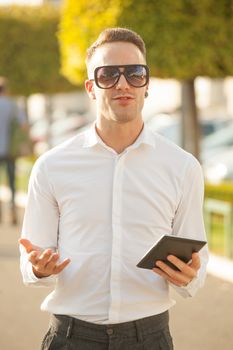 Traveling Man With Mobile Phone And Hat, In City, Urban Space