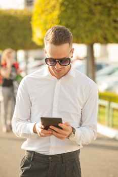 Traveling Man With Mobile Phone And Hat, In City, Urban Space