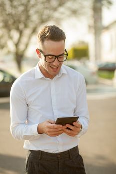 Man with glasses speak on mobile phone, In City, Urban Space, Park