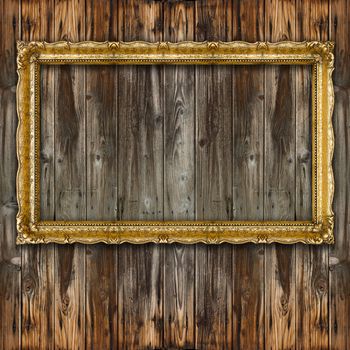 Retro Big Old Picture Frame on wooden baclground