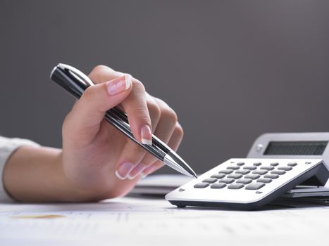 Market Analyze - pen and calculator on papers