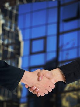 Handshake Handshaking and blured building in background