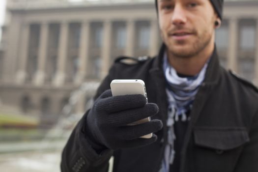 Traveling Man With Mobile Phone And Hat, In City, Urban Space