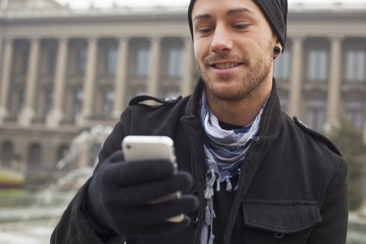 Traveling Man With Mobile Phone And Hat, In City, Urban Space