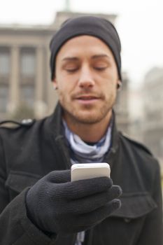 Traveling Man With Mobile Phone And Hat, In City, Urban Space