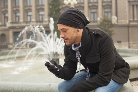 Young Man With Mobile Phone Outdoor