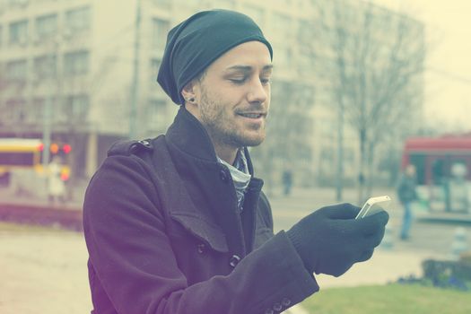 Traveling Man With Mobile Phone And Hat In City, Urban Space