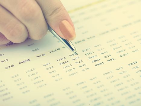 Market Analyze - pen and numbers on paper