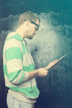 Good Looking Young Man Using Tablet Computer