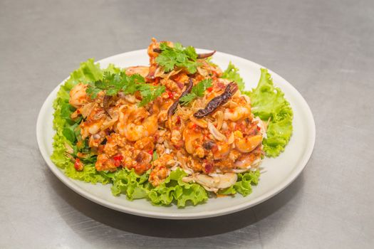 Spicy Seafood Salad, Mix of Squid, Shrimp and Shellfish with Spring Onion, Lettuce, Red Chili and Parsley, Thai food or Cuisine