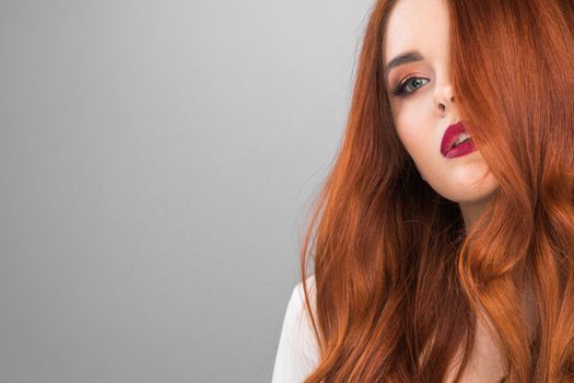 Photoshot of gorgeous redhead girl with bright makeup