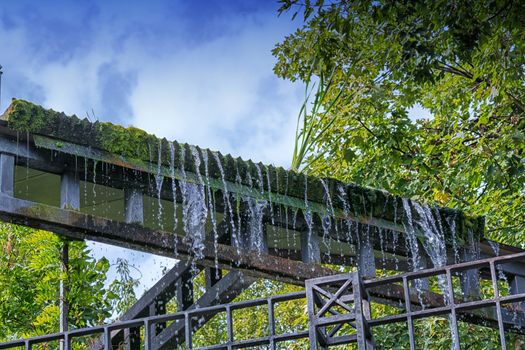 Small weir waterfall in a public park