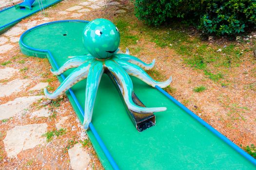 Mini golf course with obstacles, giant octopus, squid