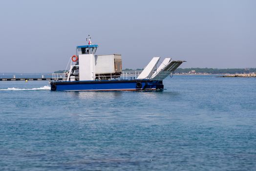 Small local ferry for one car or small truck connecting nearby islands with the mainland