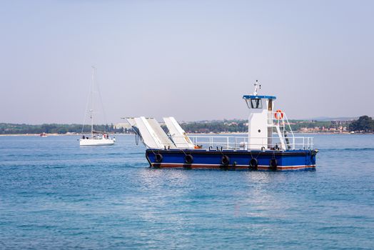 Small local ferry for one car or small truck connecting nearby islands with the mainland