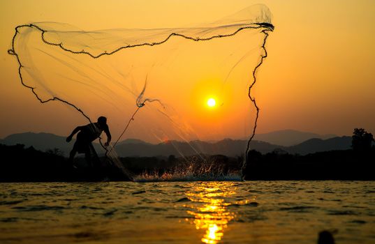 sunset Light and shadow fishermen.