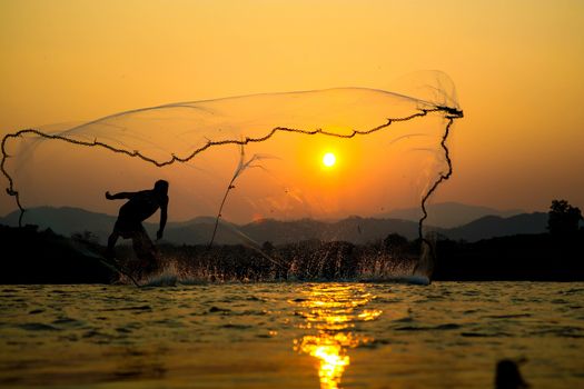 sunset Light and shadow fishermen.