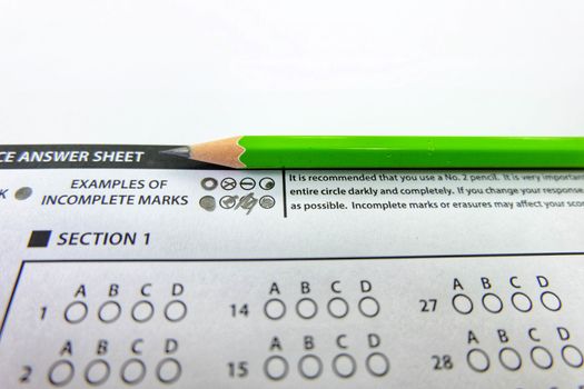 The green pencil drawing selected choice on answer sheets,light morning stytle,focus examples of incomplate marks