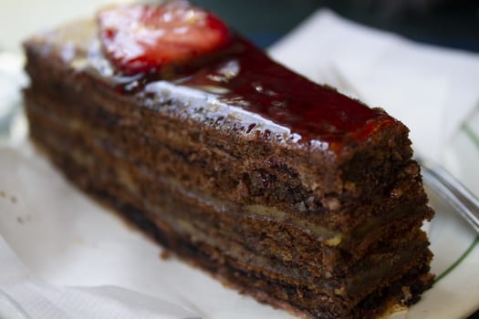 sweet chocolate cake with strawberries whit topping