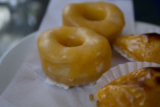 Typical Portuguese desserts with egg cream and icing of sugar