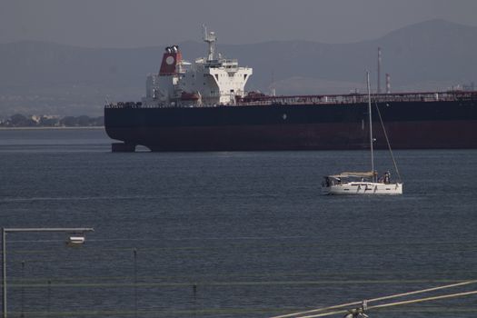 Merchant ship waiting outside the port of lisbon