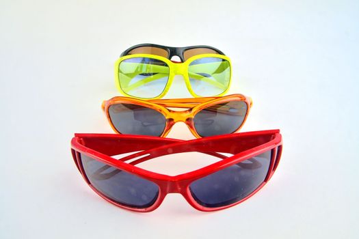 Set of various glasses. Stylish sunglasses for women and children. Eye glasses collection on white background.