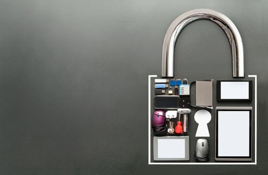 Various devices including tablets, computer mouse, usb cards in the shape of a padlock on a chalkboard background