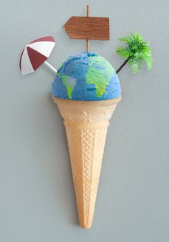 Ice cream cone with atlas map and vacation items including beach post, parasol and palm tree
