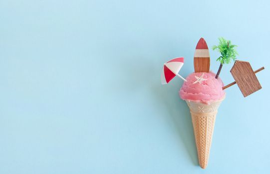 Strawberry icecream with beach items below sun 