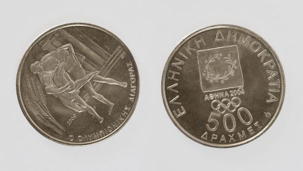Greek coin issued for olympic games in Athens. Isolated with path on white background.