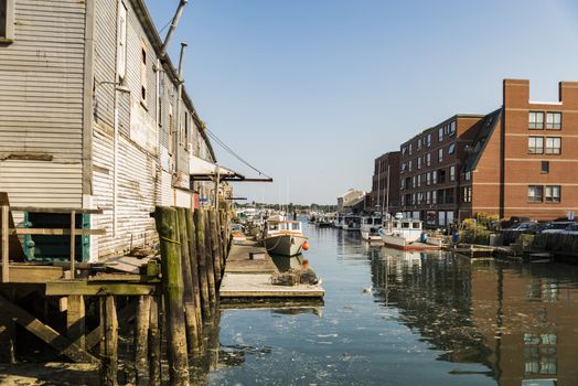 old docks and boats in the touristic harbor in Portland, Maine, USA