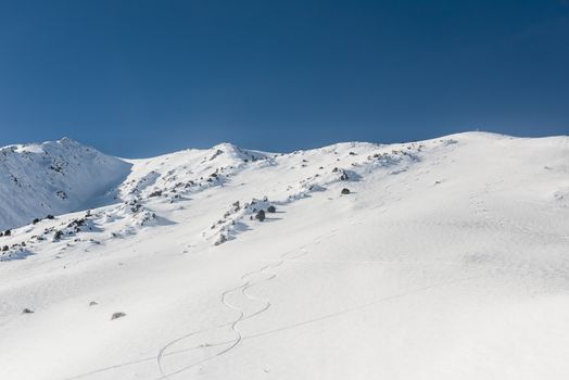 Hillside with ski tracks in Mammoth Lakes, California, January 2017, a record snow-fall year