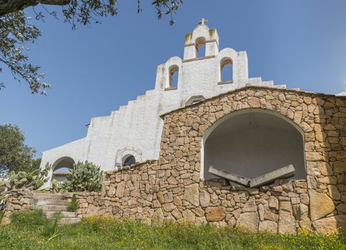 the white holy church in marinella on sardinia island with a bible made from stone