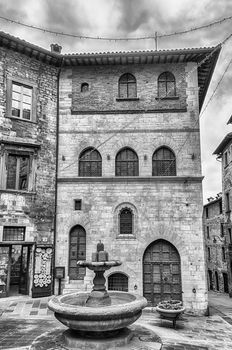 View of Palazzo del Bargello, a medieval building facing the scenic Piazza Grande in Gubbio, Umbria, central Italy