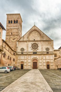 Exterior view with facade of the medieval Cathedral of Assisi, Italy. The church is dedicated to San Rufino