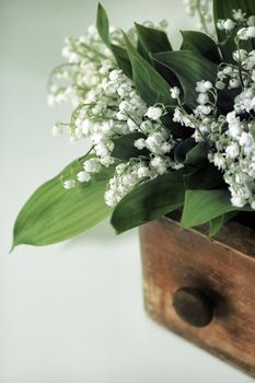 Bouquet of Lilies of the Valley in wooden box