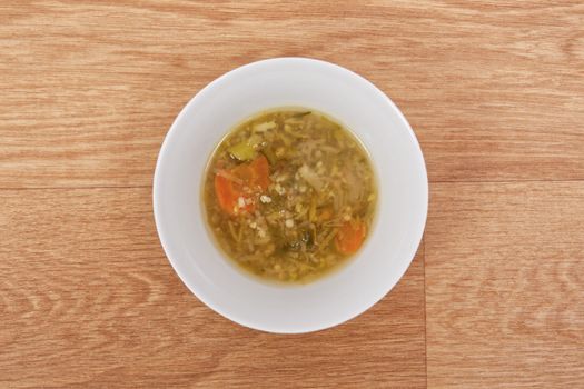 Miso vegetable soup with vegetables on a wooden table
