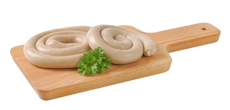 raw white wine pork sausages on wooden cutting board