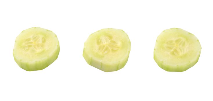 three slices of fresh cucumber on white background