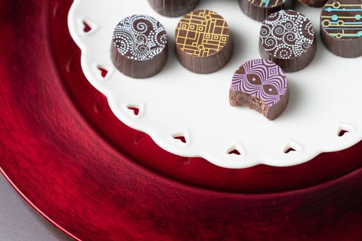 Artisan Fine Chocolate Candy On Serving Dish with Heart Design.