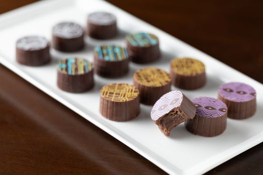 Artisan Fine Chocolate Candy On Serving Dish.